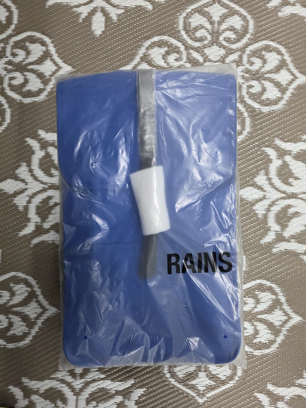 Rains Blue Rolltop Backpack with Black Closure